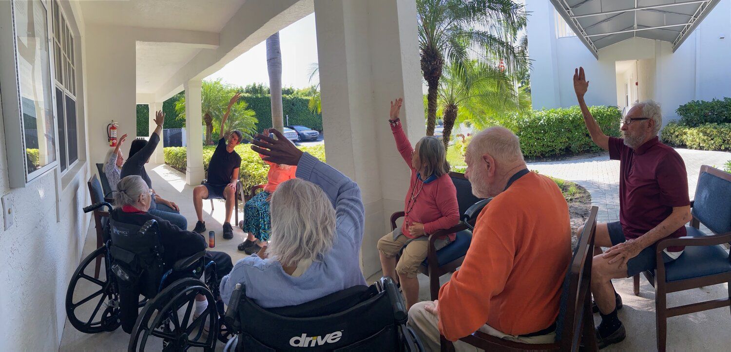 Residents seated for the start of a chair-yoga session
