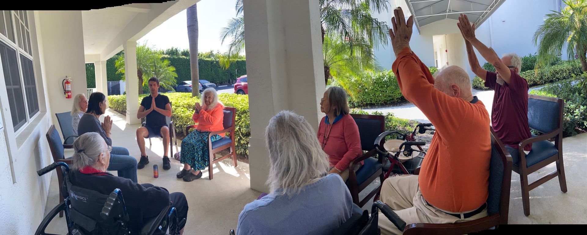Guided arm stretch during chair yoga