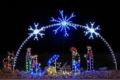 Nativity scene lit with Christmas lights